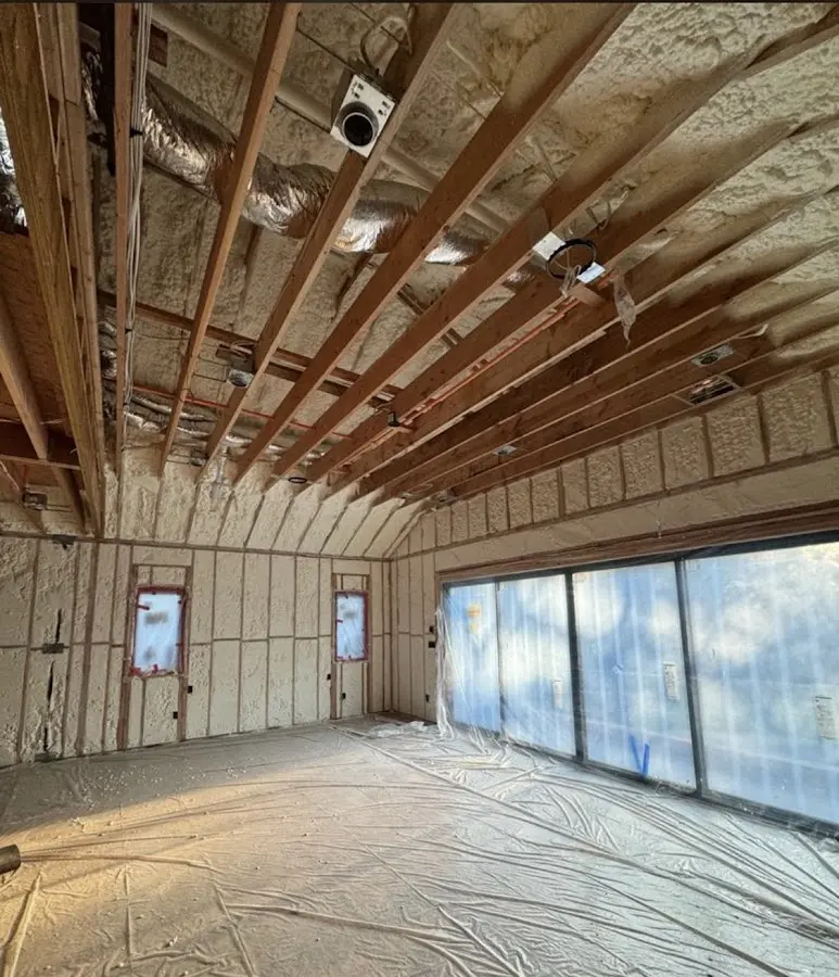 Interior walls and ceiling insulated with spray foam during new construction in St. Rose